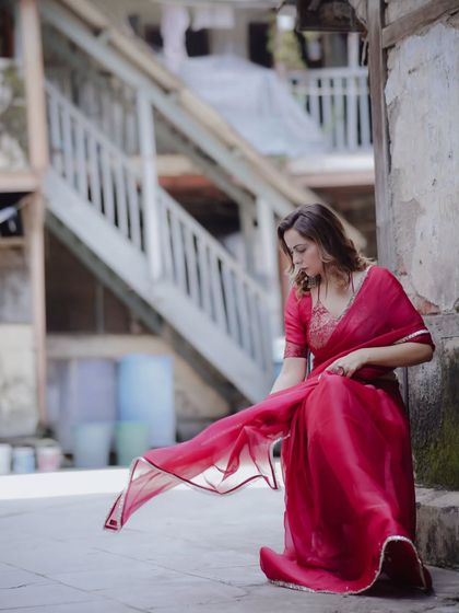 Here, the movement of the saree is the hero. I wanted to capture the fabric's lightness and flow against the gritty, textured walls of this South Mumbai location.