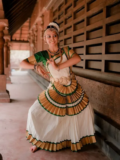 Capturing the grace of cultural art forms is a passion of mine. This portrait of a Mohiniyattam dancer shows the elegance of the pose and the beauty of the traditional costume in an authentic architectural setting.