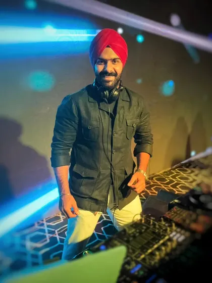 Your go-to DJ in Delhi for unforgettable moments. A confident shot from behind the console, ready to make the celebration electric.