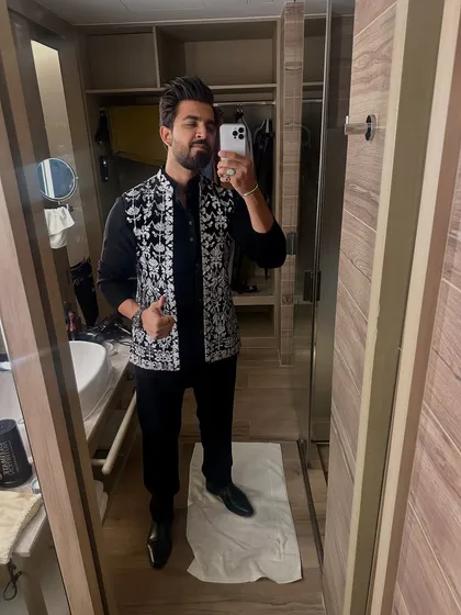 Another mirror selfie, checking the final look before heading out. Details matter.