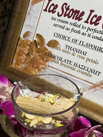 A close-up of our Ice Stone Ice Cream station, featuring Thandai and Chocolate Hazelnut flavors, ready to be rolled and served.