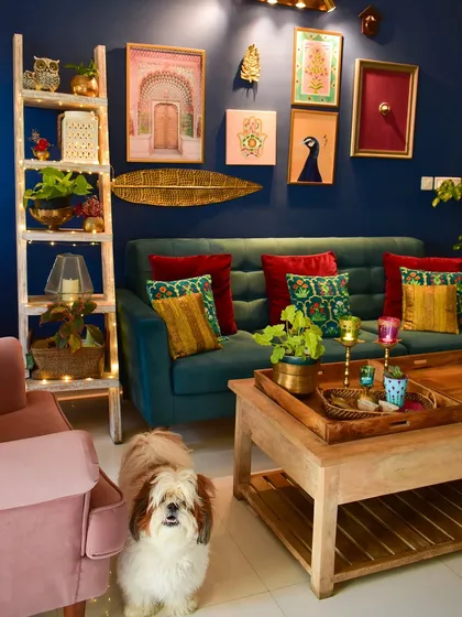 Don't be afraid of a little color. This bold blue wall in my living room comes alive with a gallery of art and, of course, lots of plants. I love styling spaces that reflect your personality, creating a home that is uniquely yours.