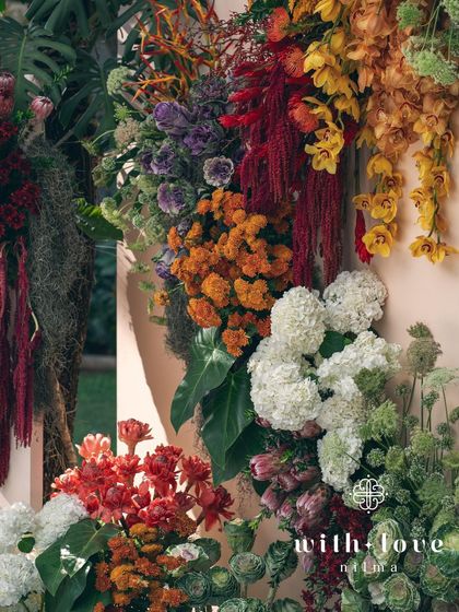 Another detail of the 'Garden of Gaia' floral wall, showing the vibrant mix of colors and textures. Each flower is carefully placed to create a harmonious and abundant composition.