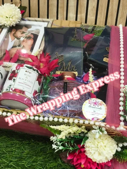 The complete hamper for the newly married couple, wrapped and decorated with flowers, ready for gifting.