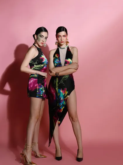 This image showcases my work in creative and art direction for a fashion campaign. I styled these bold, artistic looks with vibrant, abstract-print fabrics and directed the models' strong poses to create a visually striking narrative.