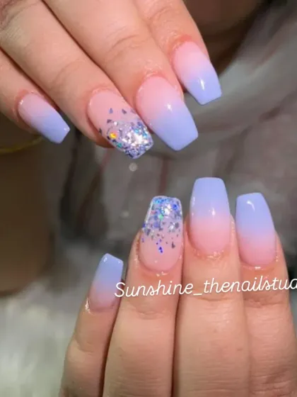 A lovely set with a lavender ombre and chunky glitter accent nails.