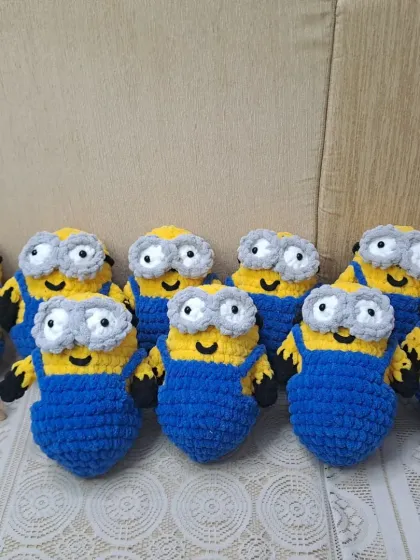 A group of my crochet minion soft toys. These popular characters are a hit with kids and are made with soft, plush yarn.