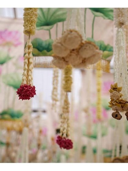 A close-up of the hanging floral decor with lotus drapes, a beautiful and unique way to incorporate artistic elements into a ceiling design.