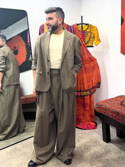 I practice the style philosophy I preach. This bespoke ensemble, which I designed for myself, combines fluid tailoring and earthy tones, reflecting a blend of contemporary design and artisanal comfort that is central to my personal aesthetic.