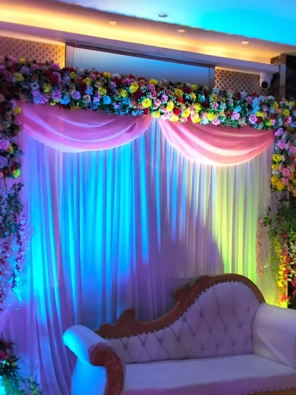 The stage illuminated with a mix of blue and pink lights, showing how we use lighting to change the mood and match your event's color scheme.