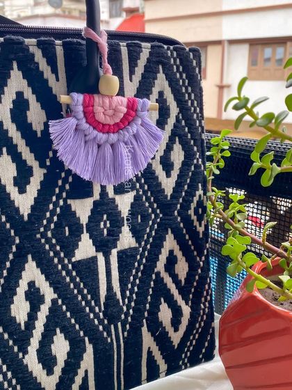 This little macrame doll charm is just too cute! With a wooden bead for a head and a colorful dress, it's a playful accessory for any bag. These make wonderful and unique return gifts for parties.