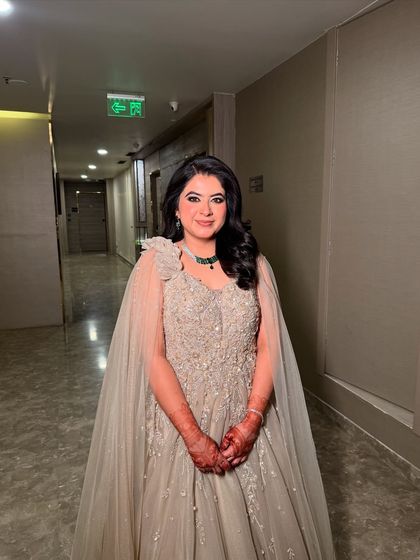 Another shot of Sanchi's engagement look, showing the beautiful flow of her gown and the elegance of her overall style.