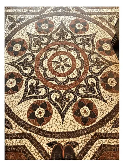 A close look at the intricate china mosaic flooring we inherited. We meticulously documented these beautiful, handcrafted patterns to ensure that any repairs or new sections would integrate perfectly, preserving the artistry of the original craftsmen.
