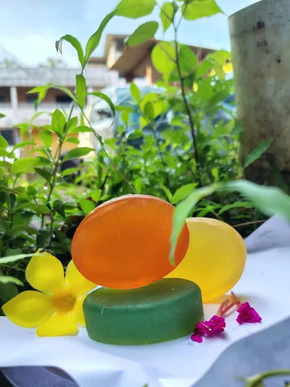 My handmade herbal soaps, pictured here in their natural element. These bars are made with ingredients like Tulsi and Neem and come in Lemon, Jasmine, and Sandalwood fragrances for a gentle, natural clean.