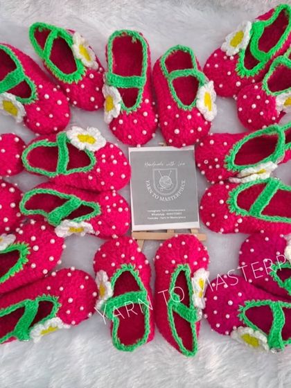 A whole patch of my strawberry booties. The "seeds" are actually tiny, securely stitched pearls.