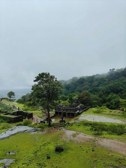 The ancient ruins and lush green landscape of Kavaledurga Fort, one of the historical sites we explore during our Kodachadri trip.
