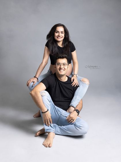 Celebrating love, laughter, and the beautiful journey to parenthood. This playful pose shows the fun and joy of expecting together.