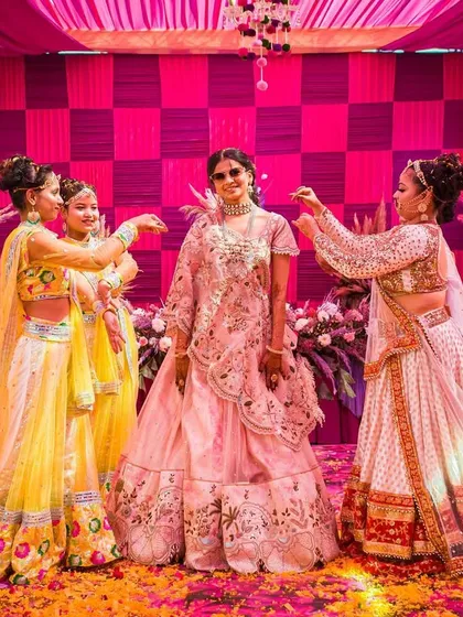 A playful moment during the bride's Haldi performance. Our choreography focuses on creating beautiful memories and picture-perfect moments.