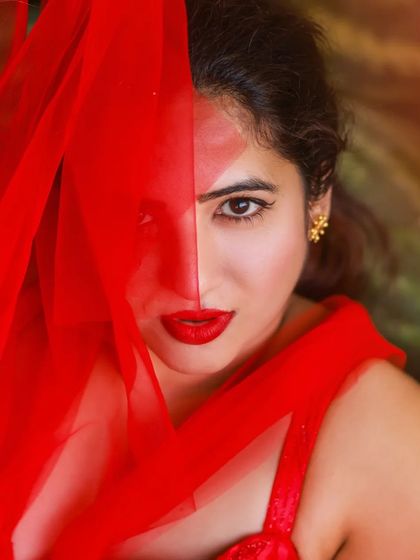 A creative and vibrant summer-themed shoot with an actress in a red outfit surrounded by watermelons. This series is playful and colorful, perfect for a brand campaign or a unique portfolio piece.