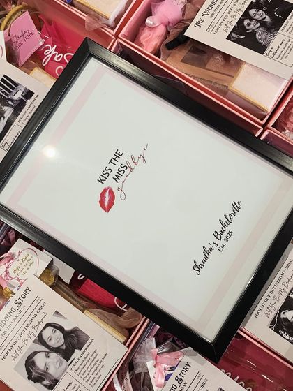 Fun activities for the bachelorette party! This "Kiss the Miss Goodbye" frame is a memorable and interactive keepsake for the bride from her tribe.