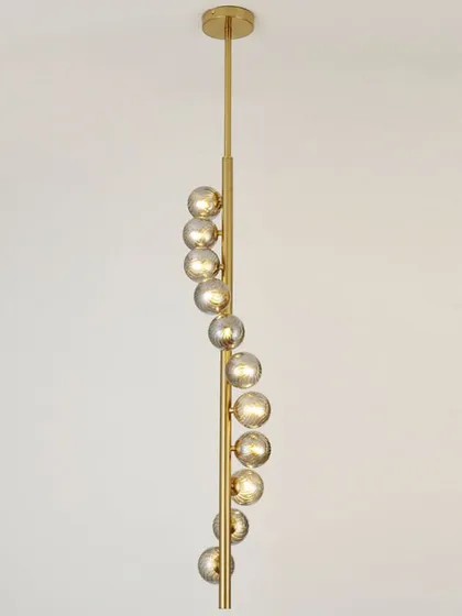 A vertical spiral pendant with smoked glass globes. This is a sleek and modern solution for narrow spaces or stairwells.