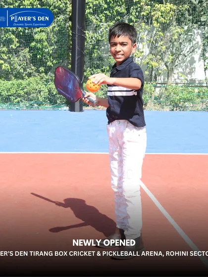 A young boy gets ready to try his hand at pickleball during the opening of our Rohini facility. We aim to introduce new and exciting sports to the community.