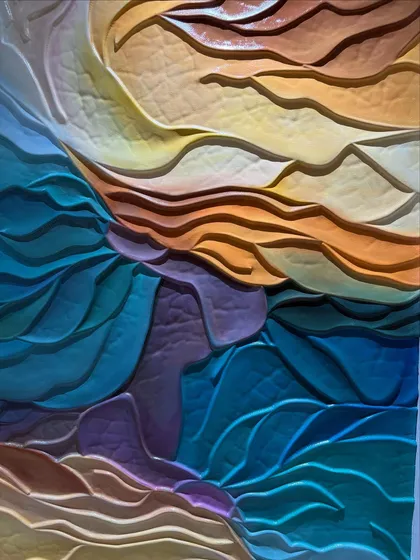 A close-up of the 3D wave effect mural, where you can really see the texture and the way the colors blend into each other.