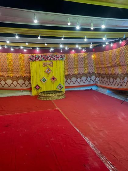 Another wide view of the venue, showing the spacious floor area for guests and rituals, all enclosed within our custom-decorated pandal.