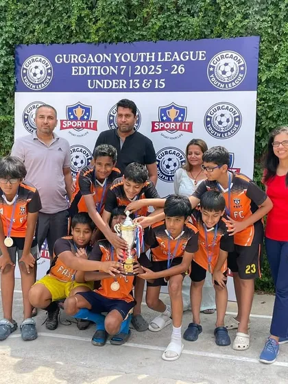 The U13 Blue team and their families celebrating a successful tournament run.