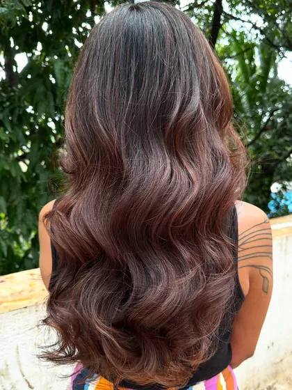 A fresh new look for this client. We did a full color transformation to this rich chocolate brown and finished with a healthy cut and bouncy blowout. The smile at the end says it all.