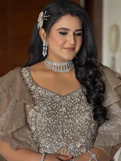 A close-up of the bride's reception glam. The look is bold and beautiful, with a focus on the eyes and a flawless, glowing complexion.