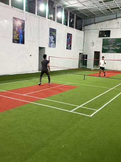 A singles game under the lights. Perfect for a late-night session.