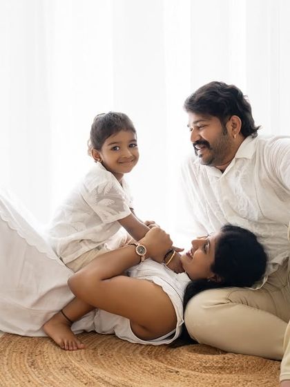 A playful family pile-up! These fun, candid shots are often the favorites from a family session.