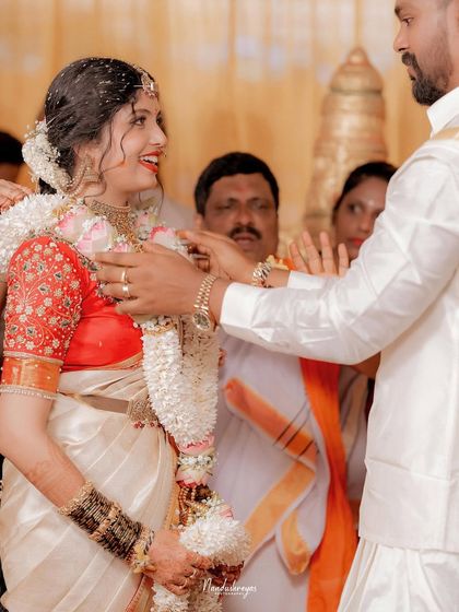 A candid moment of laughter and joy between the couple during their wedding ceremony. These spontaneous interactions are the heart of my storytelling approach.