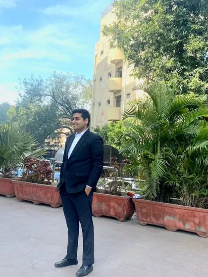 In the courtyard of a Delhi court complex. I am comfortable and familiar with the grounds where your legal battles are fought.