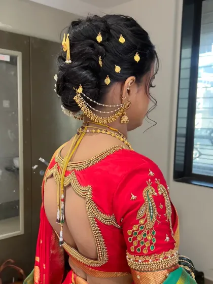 A different hairstyle variation with a braided bun and gold hairpins, perfect for a traditional ceremony.