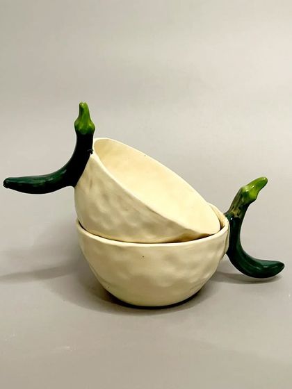 Two of my chili mugs, showing how they stack. Each mug is uniquely handcrafted, making it a special and spicy addition to your collection.