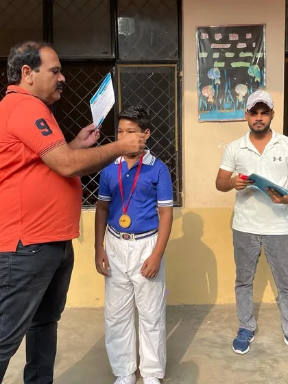 Placing the medal on a deserving champion. This is the moment all the hard training has been for.