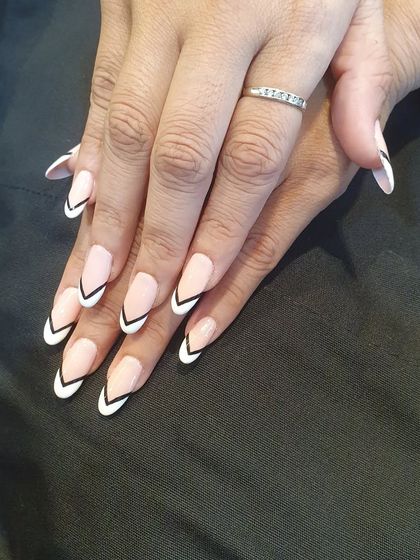 A side view of the graphic V-shaped French manicure, emphasizing the clean lines and modern aesthetic of the design.