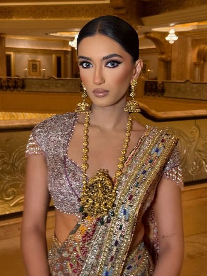 A direct, powerful portrait. The makeup is all about the eyes, with a dark, smudged liner that exudes confidence.