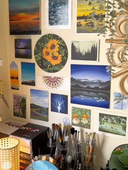 A view of my art wall, featuring a round canvas painting of three bright sunflowers. Sunflowers always bring so much happiness to my studio.