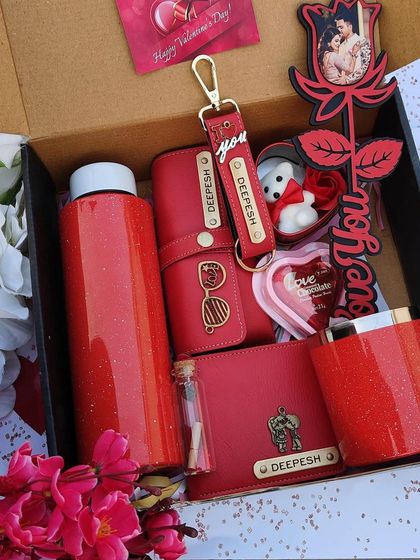 Here is the complete Valentine's Day hamper, beautifully packed in a box. It features a personalized sparkle bottle, mug, wallet, eyewear case, and a unique photo rose stick.