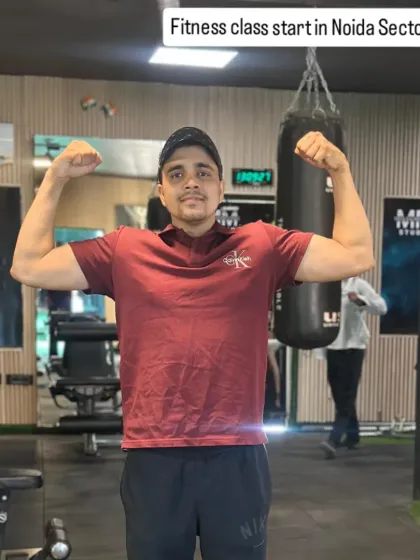 Flexing for the camera. Strength is a key component of my athletics training.