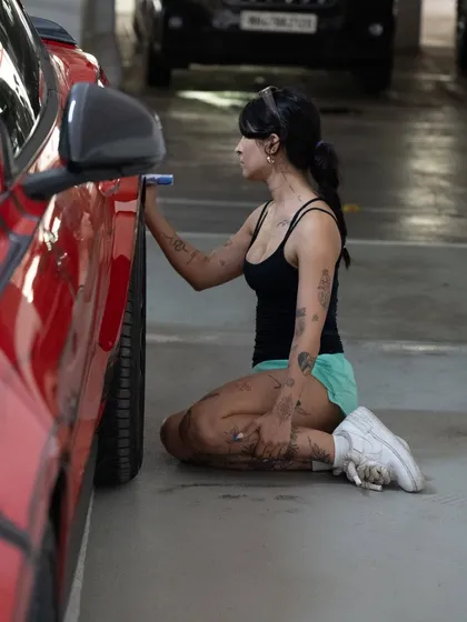 Breaking my back for art, literally. Getting into the zone while working on the lower panels of the custom-painted Mustang.
