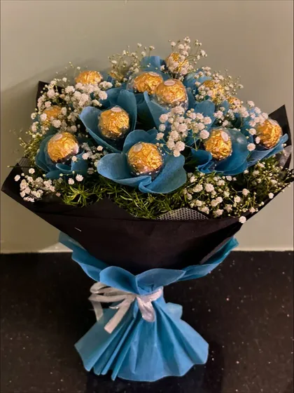 Another view of our popular blue Ferrero Rocher bouquet, showing the full arrangement and how the colors come together to create a visually stunning gift.