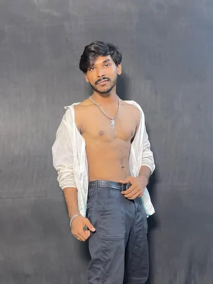An unbuttoned shirt look, showcasing a more edgy and bold style. I am not afraid to experiment with different fashion choices for a role.