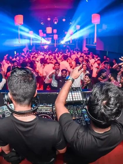 From behind the console, commanding the crowd as Tara Sitara. We work in sync to keep the energy at its peak all night.