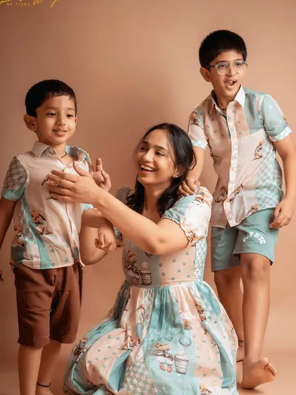 A mother's love is a beautiful thing to witness. This candid moment captures the joy and connection between a mom and her two boys.