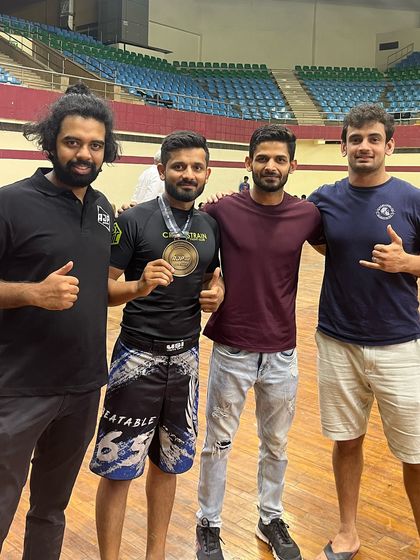 Teammates celebrating a victory together. The support of your training partners is essential for any competitor's journey.