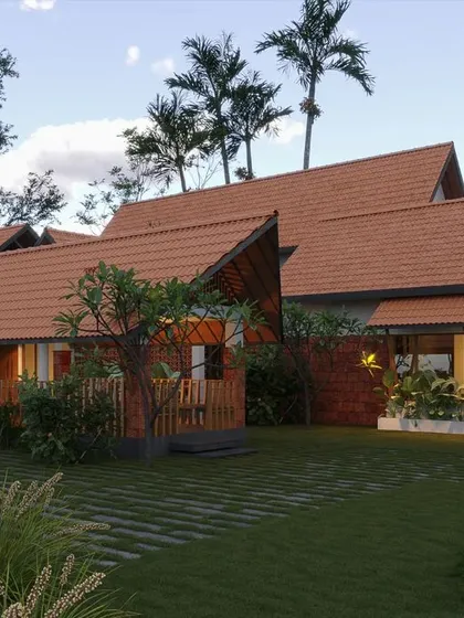 This expansive residence showcases a modern interpretation of traditional Kerala resort-style architecture. The design features multiple interconnected structures with classic terracotta roofs, creating a seamless flow between indoor and outdoor spaces.